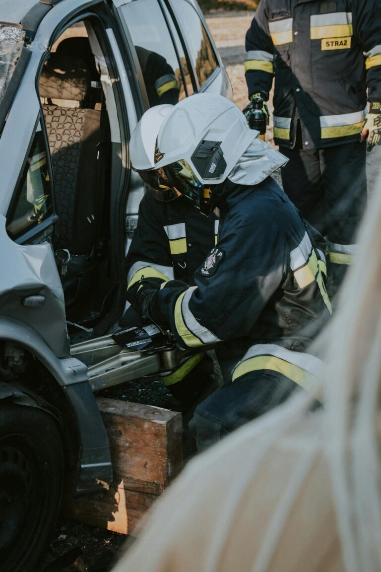 Firefighters conduct emergency extraction from a vehicle during a rescue drill in Poland.